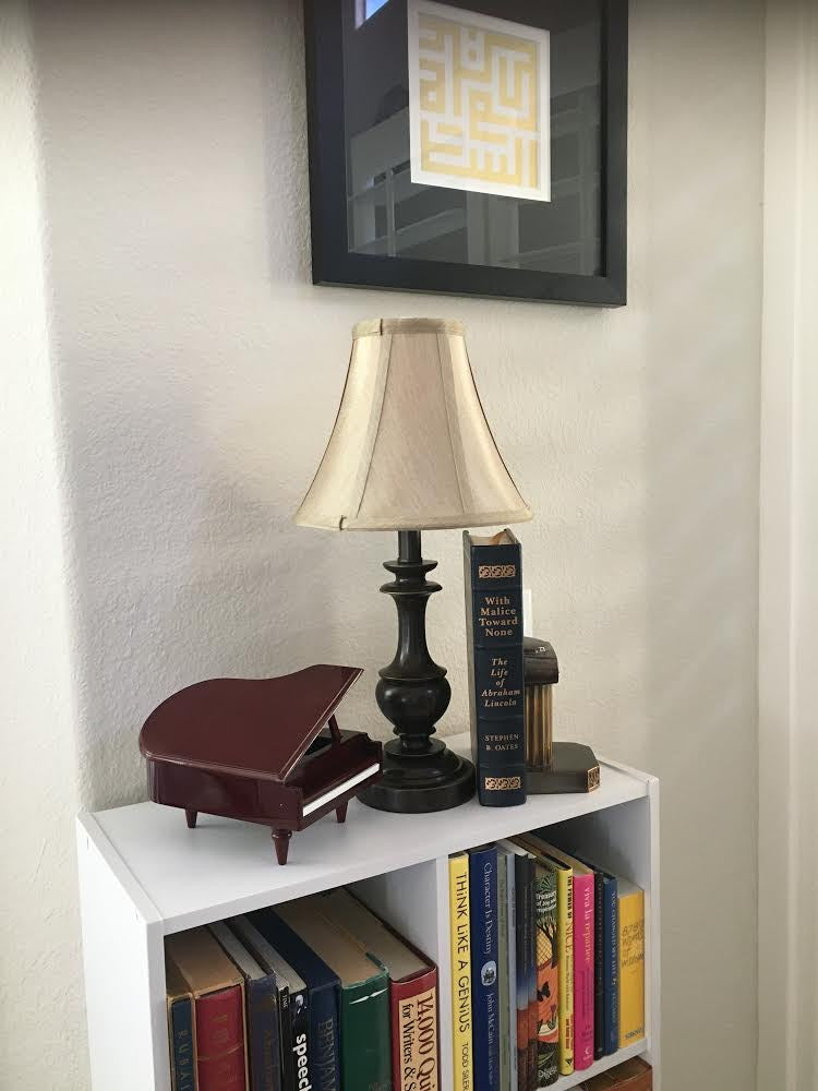 Leather bound book on top shelf of bookcase