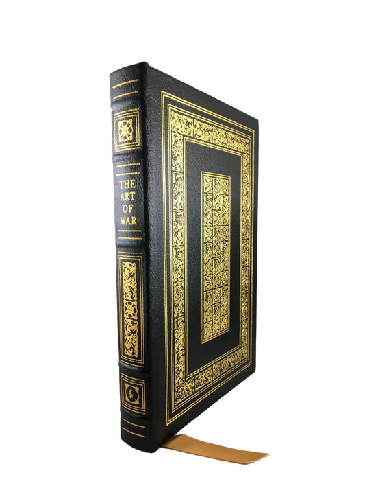 A leatherbound copy of The Art of War by Sun Tzu, with a black leather cover and gold lettering and design on the front and spine.